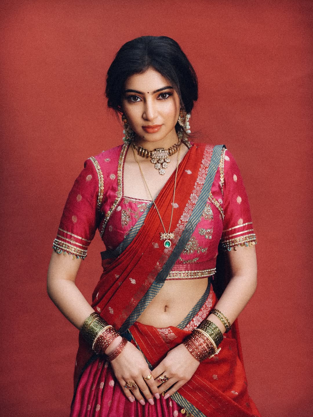 Sara Arjun - Grace in crimson, radiating timeless elegance in a red saree